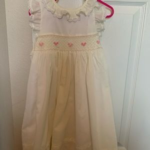 Cream colored smocked Edgehill dress.